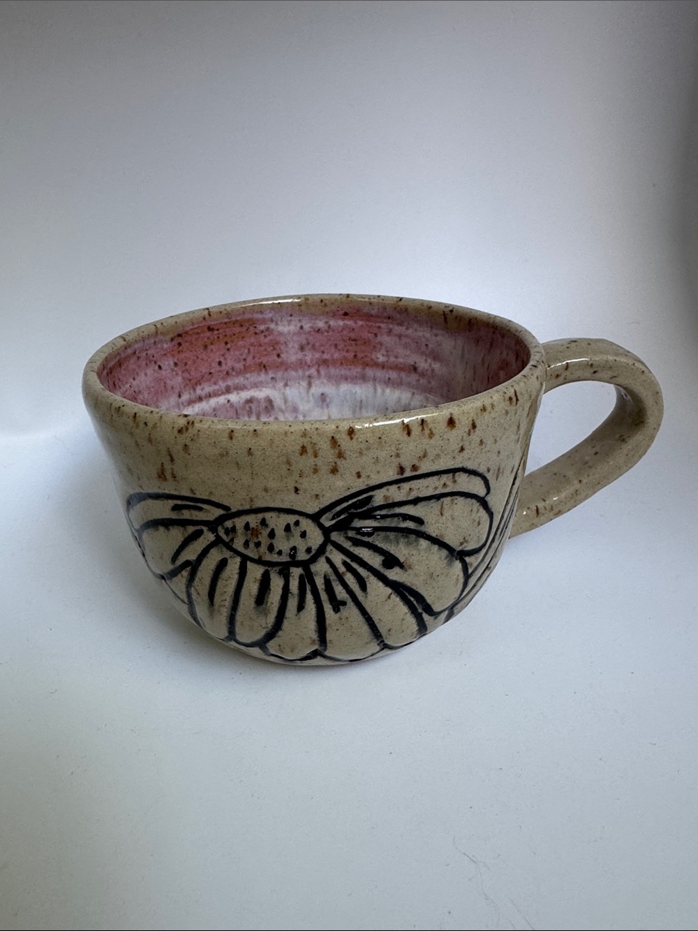 Handcrafted Ceramic Mug with Pink Interior and Floral Design